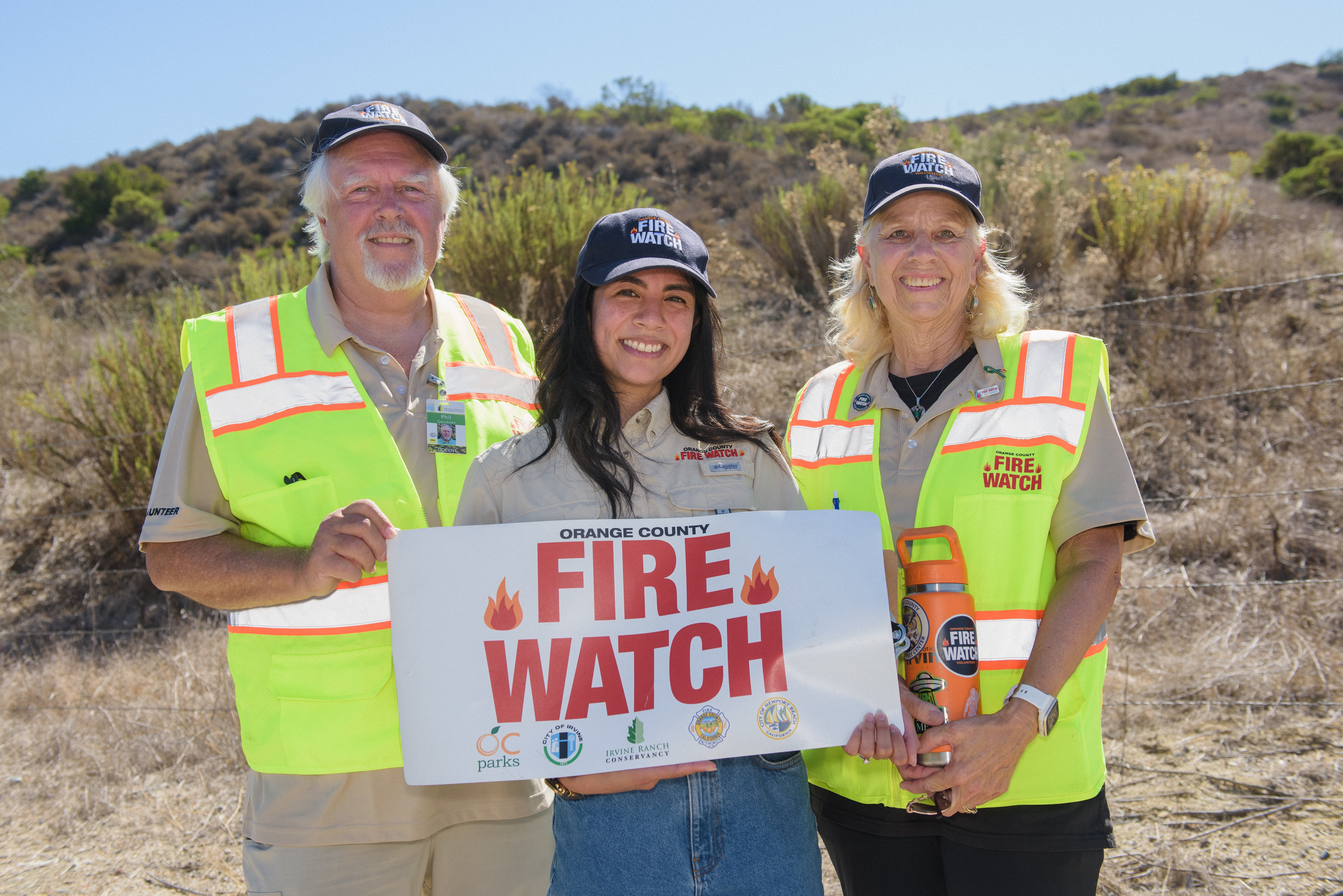 Orange County Fire Watch volunteers Phil Sallaway (left) and Noma Bates (right) with IRC Program Coordinator, Fire Prevention & Management, Renalynn Funtanilla (middle).